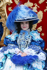 Smiling little girl wearing an antique princess dress © Kirill Kurashov