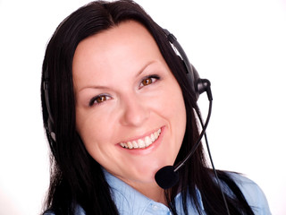 Closeup of a happy young woman using headphone