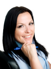 smiling brunette woman in office with pen