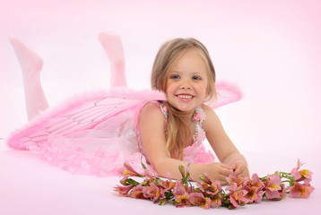 Obraz na płótnie Canvas Portrait of the small princess in a pink dress