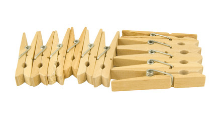selection of wooden clothes pegs isolated on white background
