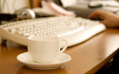 Closeup of coffee cup on workplace