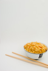 bowl of rice and chopsticks