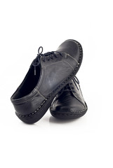 Pair of black leather shoes for women over white