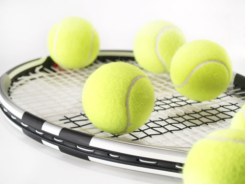 tennis racket and balls on white