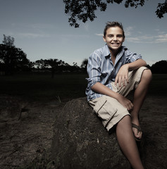 Young boy relaxing in the park