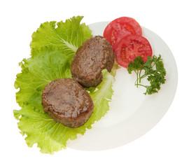 Cutlets with vegetables on a plate