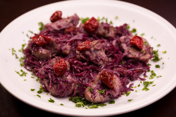 Meat with red cabbage and crandberry