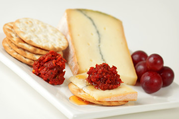Blue cheese with pesto on cracker