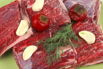 raw ribs on green dish