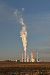 coal plant with smoking chimney