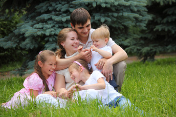 Naklejka na ściany i meble family of five outdoor in summer
