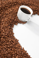 Cup with coffee, costing on coffee grain