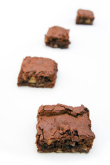 Four brownies on a white background