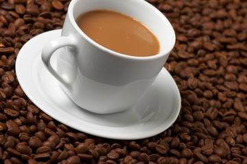 Cup with coffee, costing on coffee grain