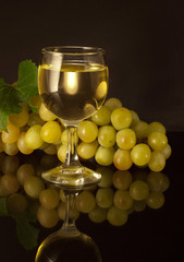 Glass of white wine on a black background