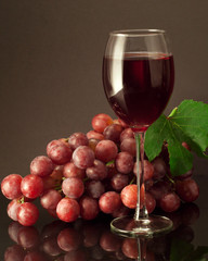 Glass of red wine on a black background