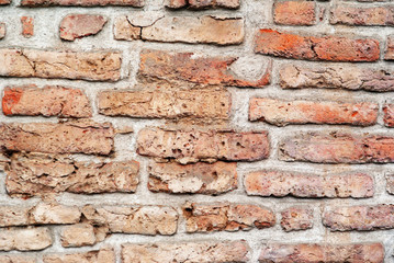 The old weathered brick wall