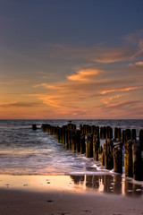 Gold Orange and Pink Sunset on an old pontoon Seaside
