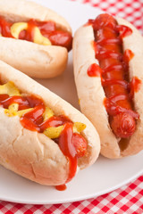 group of hot dogs on a plate