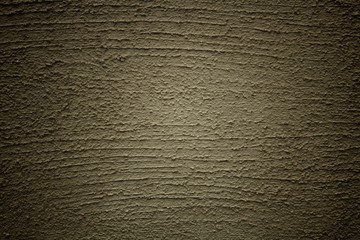 beige stucco wall background with vignette