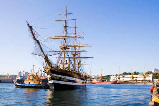The ancient military frigate moors to a mooring