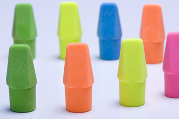 Erasers forming a circle on a white background.