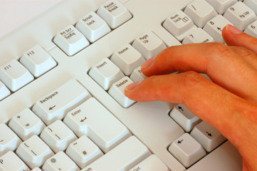 Finger pressing delete on keyboard