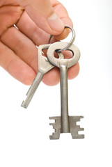 Key in the hand isolated on white