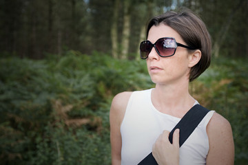 Shot of a Beautiful Brunette Lady Out for a Walk in the Forest