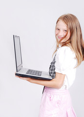 Fototapeta premium Very cute blond girl with laptop isolated