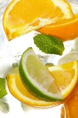 leaf mint and cut citrus in ice