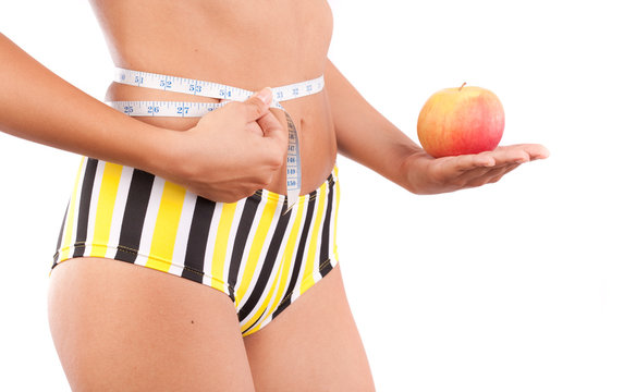 Woman torso and apple. Diet concept