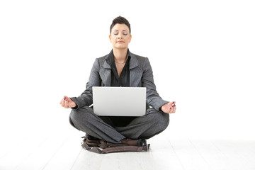 Businesswoman doing yoga