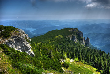 Well known Detunatele stones and Bicaz lake in Ceahlau. HDR