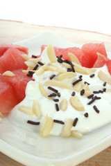 Melon and cream on a white plate