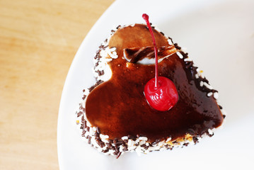 Cake on plate with cherry