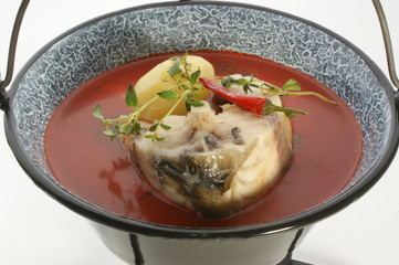 carp fish soup with fresh organic herbs