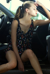 Plakat sad woman in a car