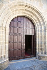 open ancient arch wood door