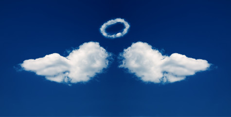 Angel wings and nimbus formed from clouds