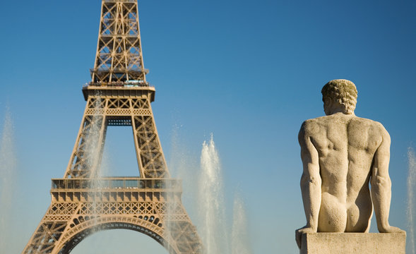 Statue of man at the Trocadero looking at the Eiffel Tower