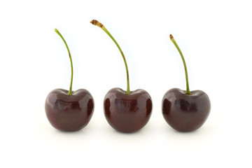 Three red cherries