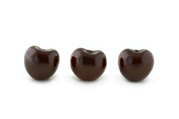 Group of three red cherries