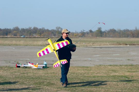 Man with radio-controlled model airplane