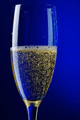 champagne glasses on blue close up