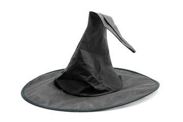 black fabric witch hat over white background