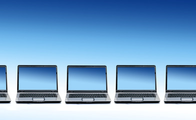 Queue of new laptops.