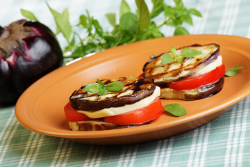 Aubergine towers with mozzarella and tomato