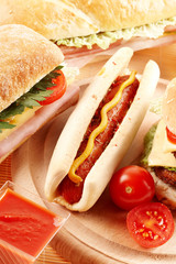 Couple hotdog,sandwich and ingredients.